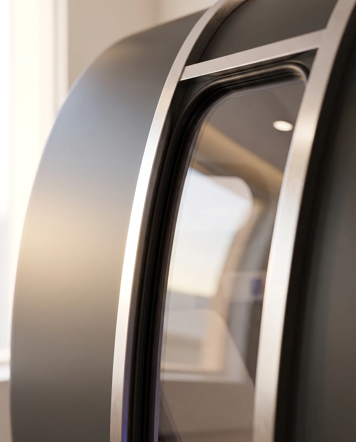 The tall clear polycarbonate door of the cabin.