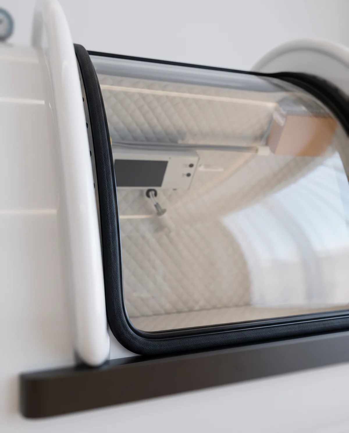 The clear viewing door set into the white shell.