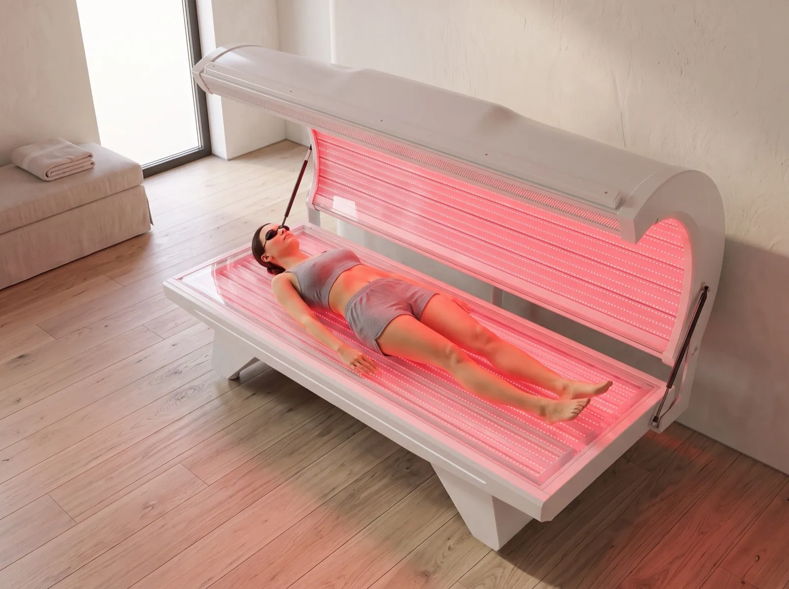Seen from above: a woman lying full length with both banks of panels lit.
