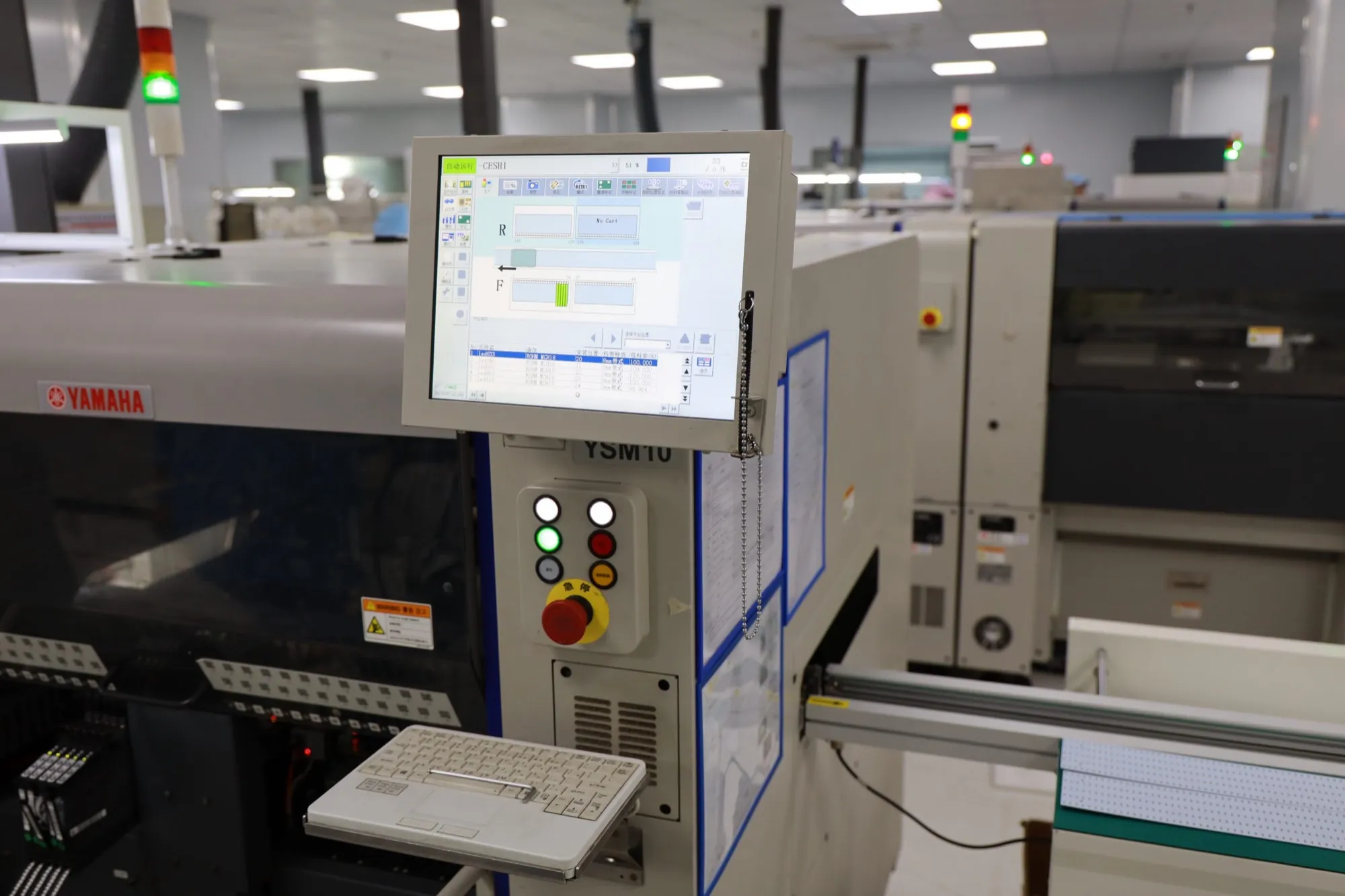 An automated surface-mount line placing components on a board.