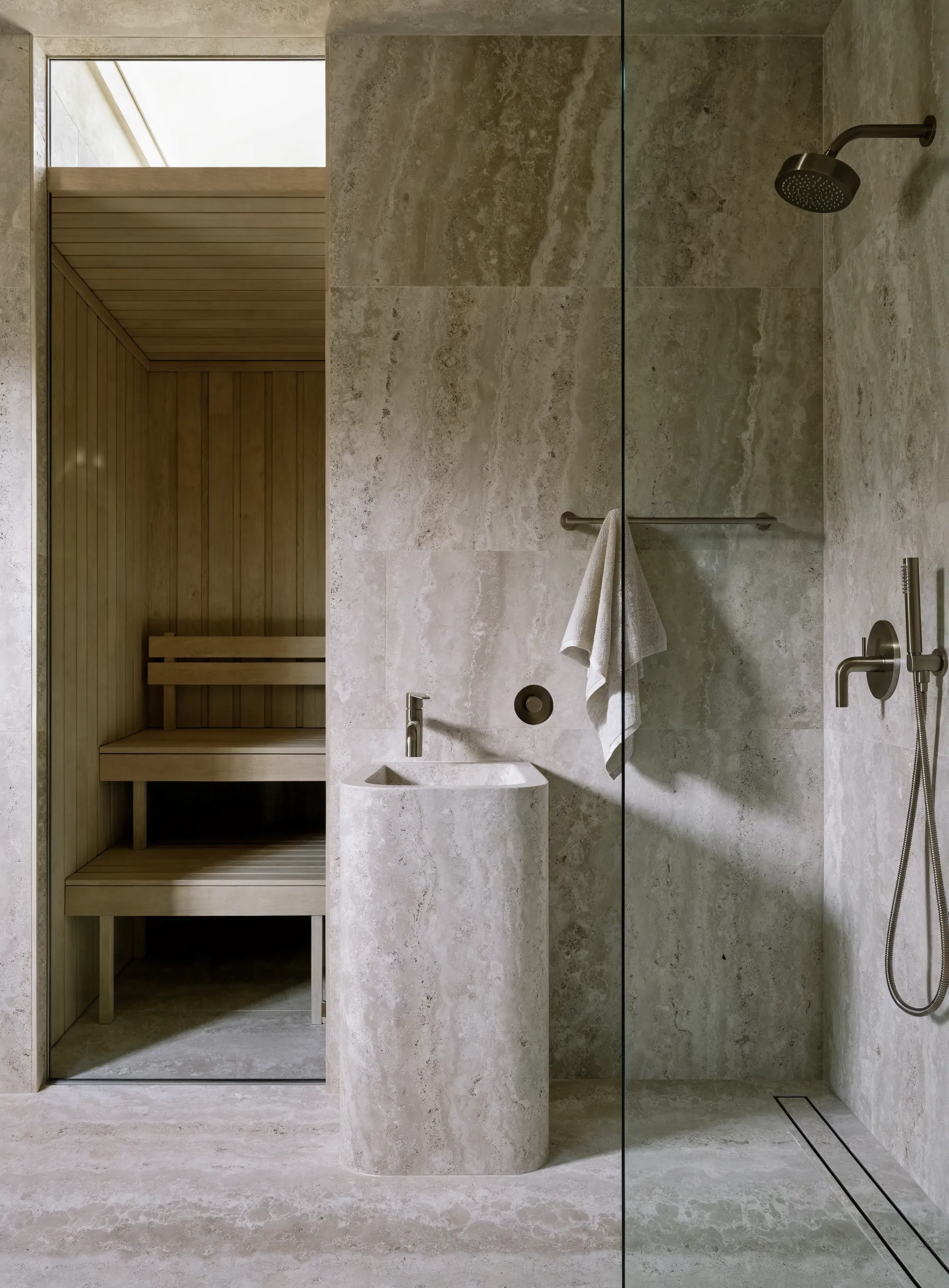 A sauna built into a stone ensuite