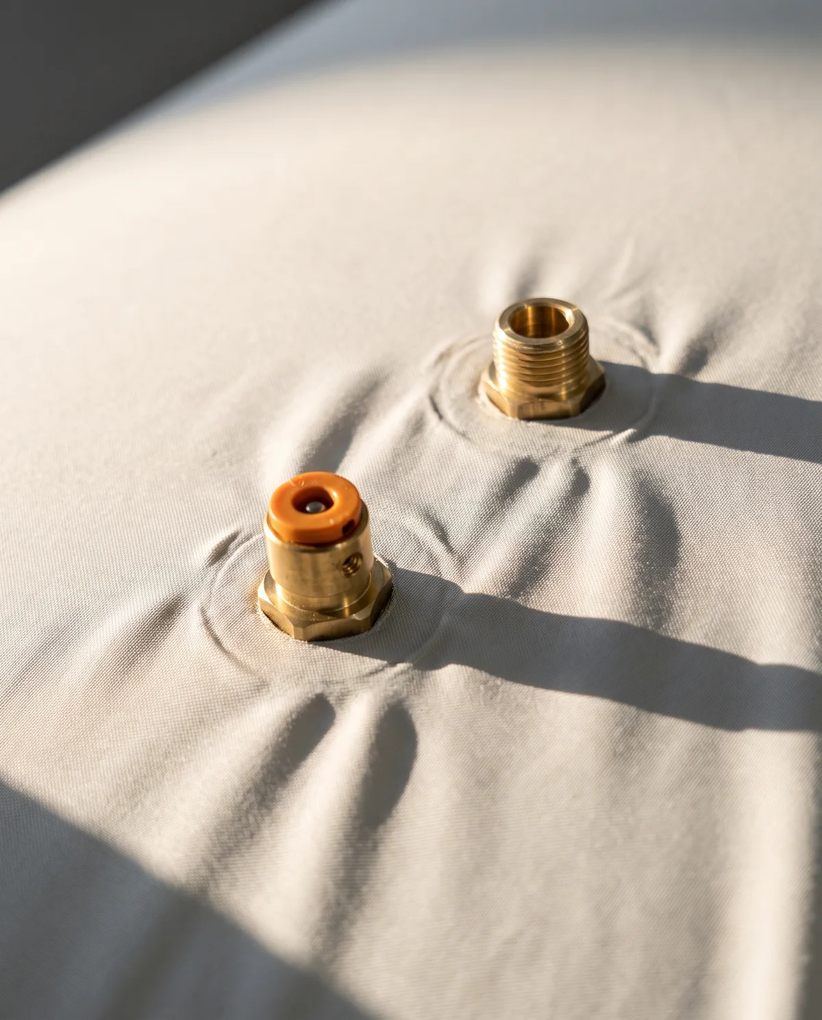 The valve fittings set into the cover.